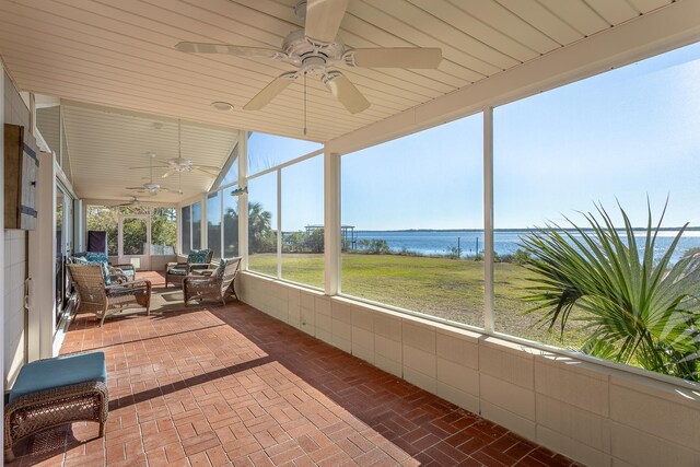 2433 Surf Rd, Panacea, FL 32346 - sunroom / solarium featuring a ceiling fan, a water view, and an outdoor living space