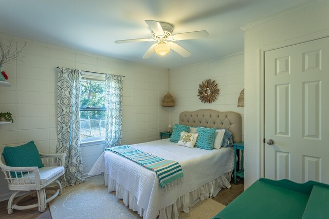2433 Surf Rd, Panacea, FL 32346 - bedroom with tile walls, ornamental molding, and ceiling fan