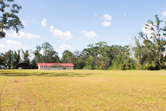 2048 W Gas Plant Rd, Perry, FL 32347 - view of grassy yard with a carport