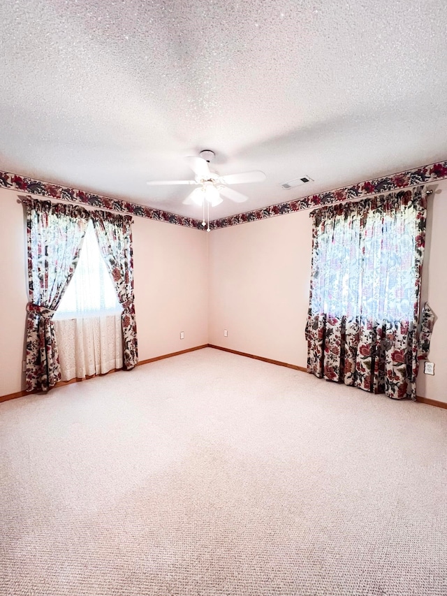 2048 W Gas Plant Rd, Perry, FL 32347 - empty room featuring light carpet, ceiling fan, and a textured ceiling