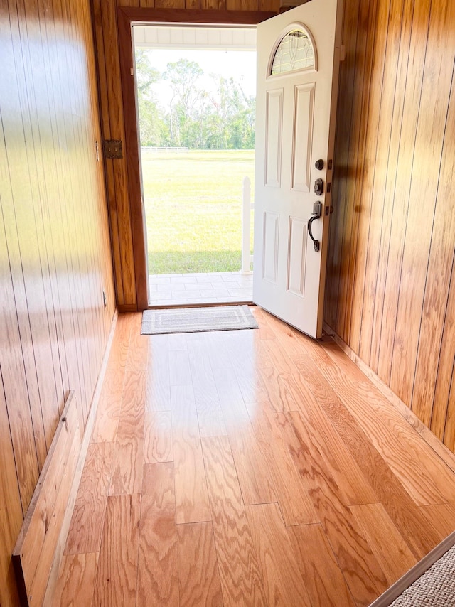 2048 W Gas Plant Rd, Perry, FL 32347 - entryway with wood walls and light wood-style flooring