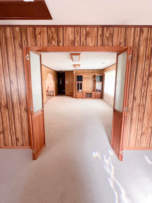2048 W Gas Plant Rd, Perry, FL 32347 - unfurnished living room with carpet flooring and wooden walls