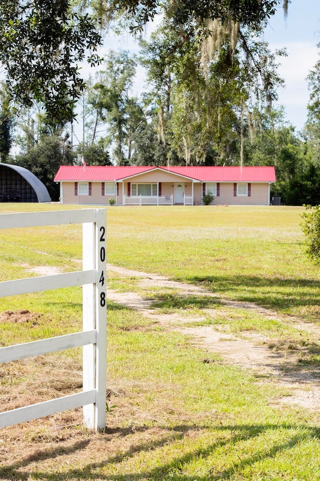 2048 W Gas Plant Rd, Perry, FL 32347 - ranch-style house with a metal roof