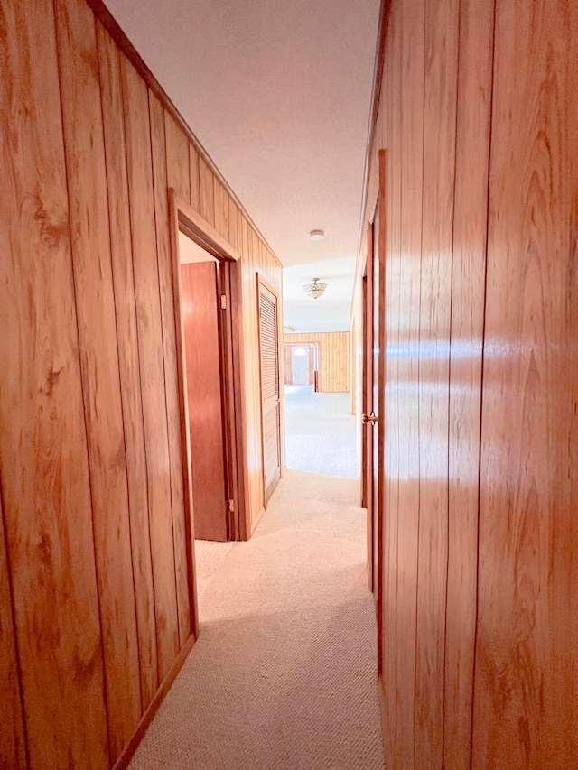 2048 W Gas Plant Rd, Perry, FL 32347 - hallway featuring carpet floors and wooden walls