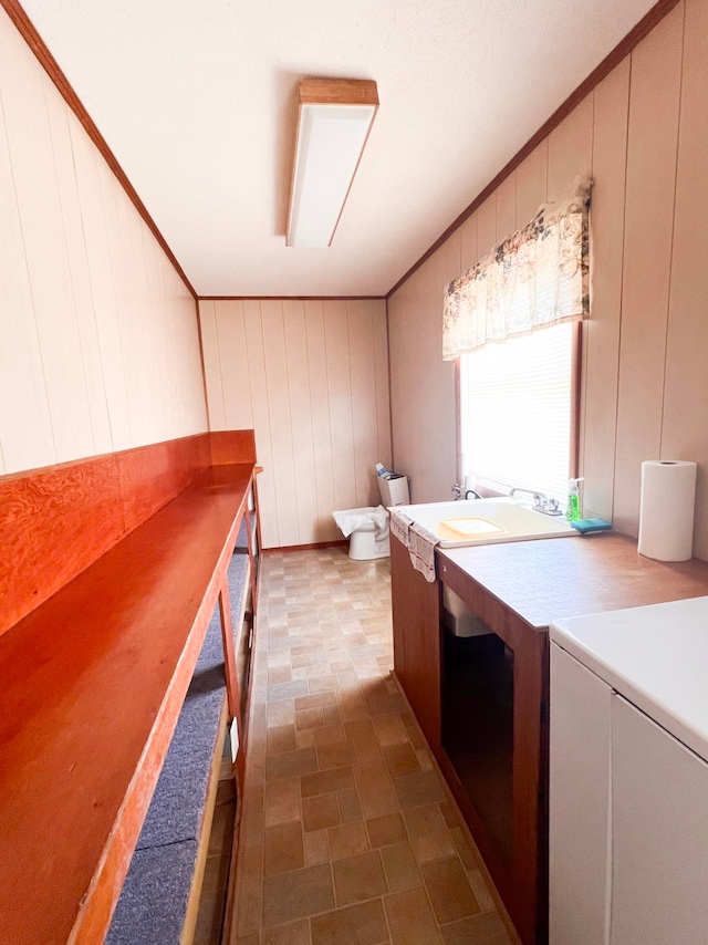 2048 W Gas Plant Rd, Perry, FL 32347 - bathroom featuring vanity, ornamental molding, and a decorative wall