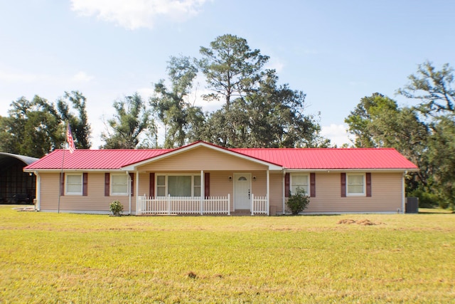 2048 W Gas Plant Rd, Perry, FL 32347 - ranch-style house featuring a metal roof, a front lawn, a porch, and a detached carport