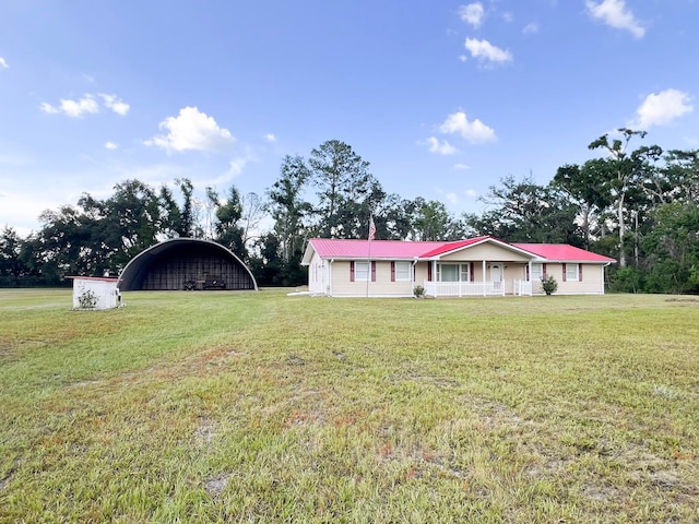 2048 W Gas Plant Rd, Perry, FL 32347 - single story home featuring a front lawn, a metal roof, and a carport