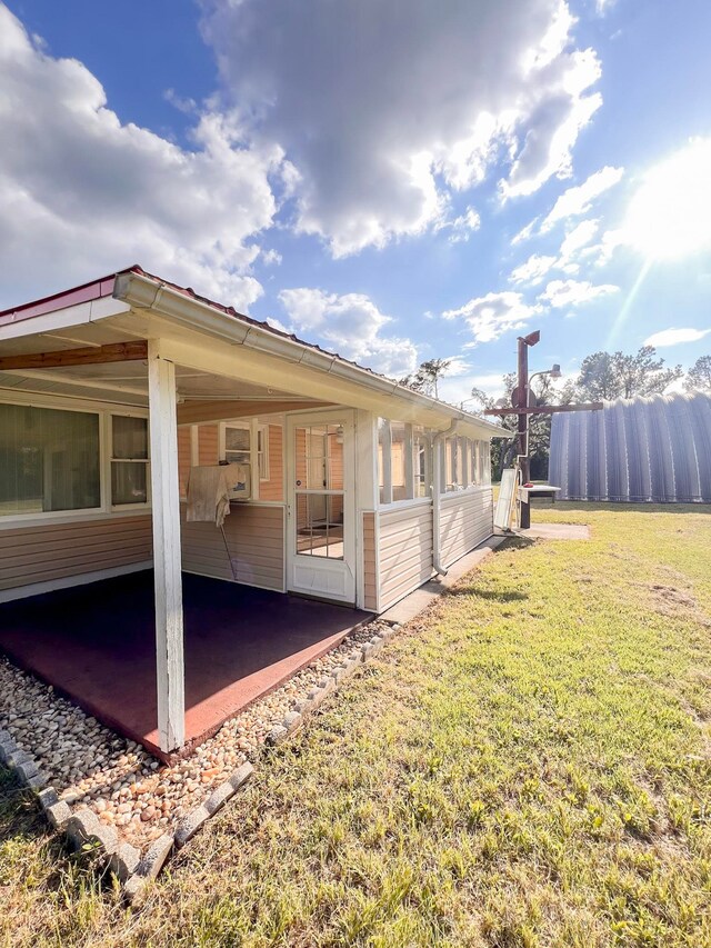 2048 W Gas Plant Rd, Perry, FL 32347 - view of home's exterior with an attached carport