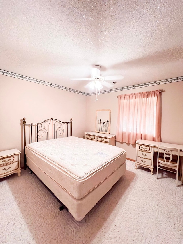 2048 W Gas Plant Rd, Perry, FL 32347 - bedroom featuring a textured ceiling, light colored carpet, and a ceiling fan