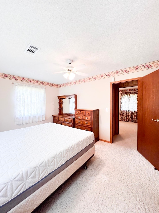 2048 W Gas Plant Rd, Perry, FL 32347 - bedroom featuring light carpet and a ceiling fan
