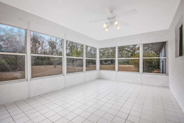 unfurnished sunroom with ceiling fan