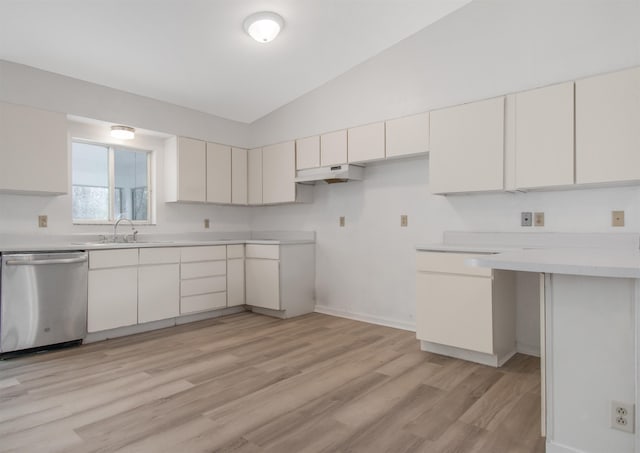 kitchen with white cabinetry, sink, dishwasher, and vaulted ceiling