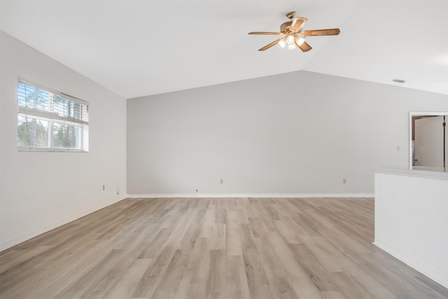 unfurnished living room featuring vaulted ceiling, ceiling fan, and light wood-type flooring