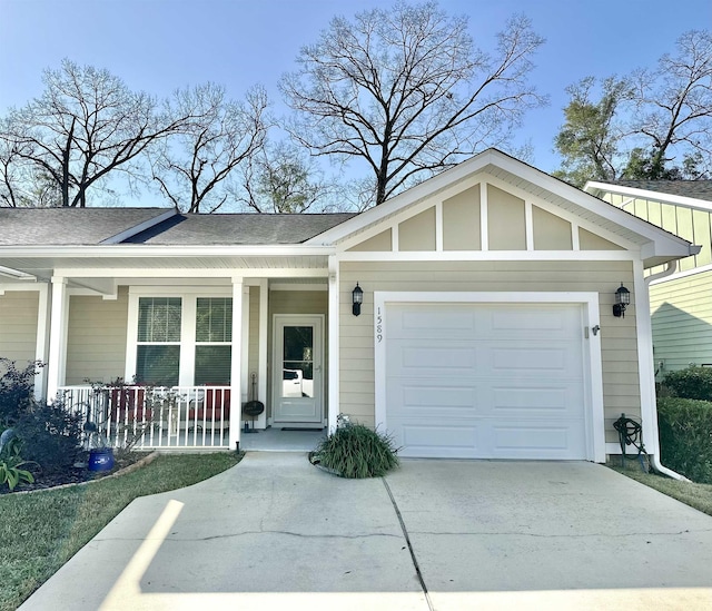 view of front facade featuring a porch and a garage