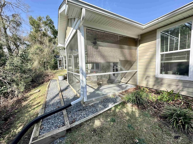 view of side of property with a sunroom