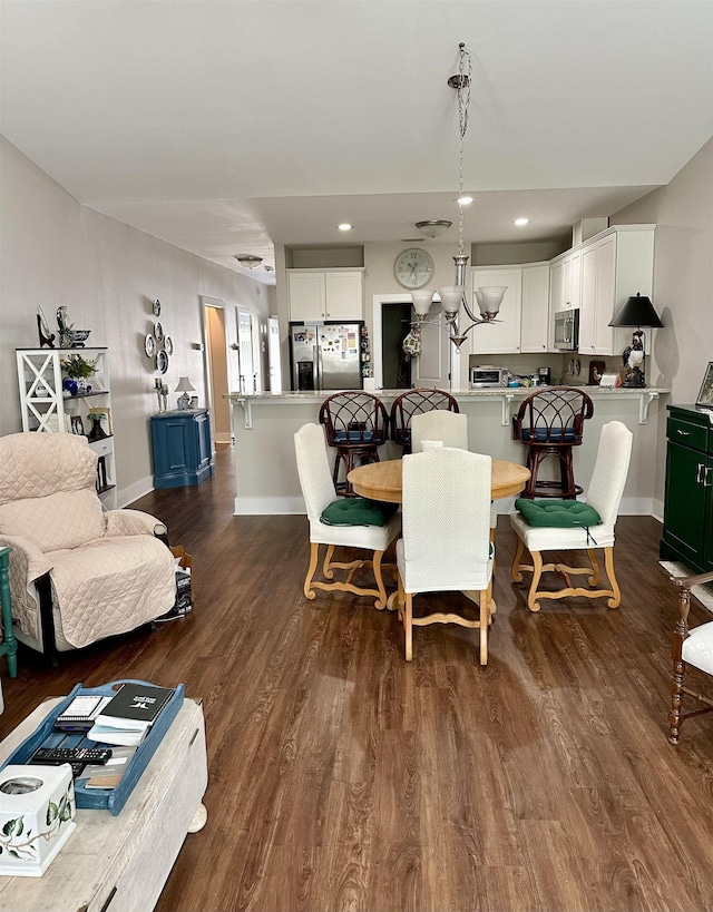 dining space with dark wood-type flooring