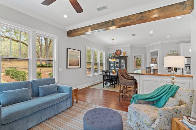 living room with crown molding, ceiling fan, beam ceiling, and light hardwood / wood-style flooring