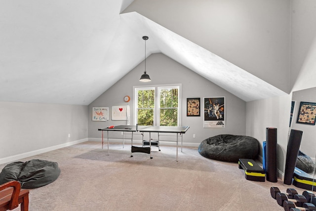 carpeted office space featuring vaulted ceiling