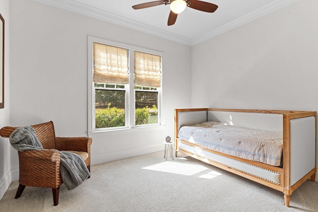 bedroom featuring ornamental molding, carpet floors, and ceiling fan