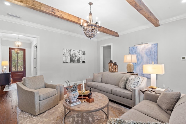 living room with wood-type flooring, crown molding, beamed ceiling, and a chandelier