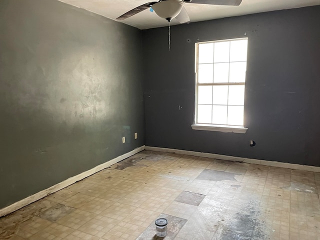 spare room with ceiling fan