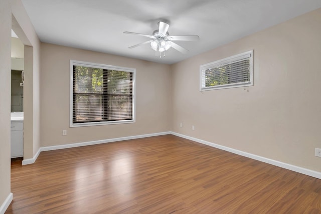 spare room with ceiling fan and hardwood / wood-style floors