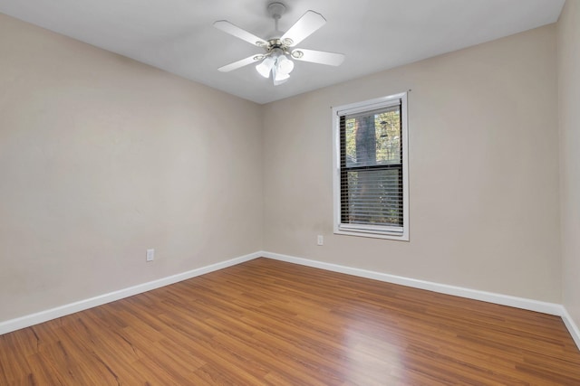 spare room featuring ceiling fan and wood-type flooring