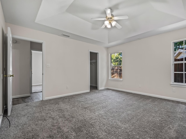 1 Black Foot Rd, Crawfordville, FL 32327 - unfurnished bedroom with a raised ceiling, carpet, a ceiling fan, and a closet
