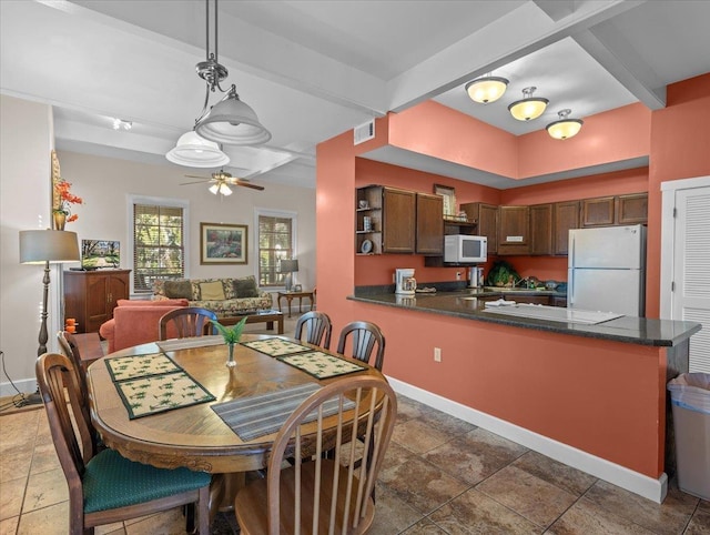 233 NE Maggie Cir, Steinhatchee, FL 32359 - dining space featuring ceiling fan, baseboards, and beamed ceiling