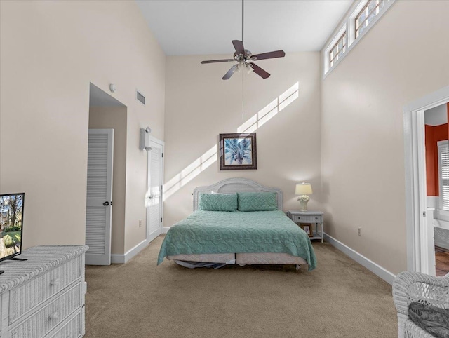 233 NE Maggie Cir, Steinhatchee, FL 32359 - bedroom with a high ceiling, carpet floors, baseboards, and ceiling fan