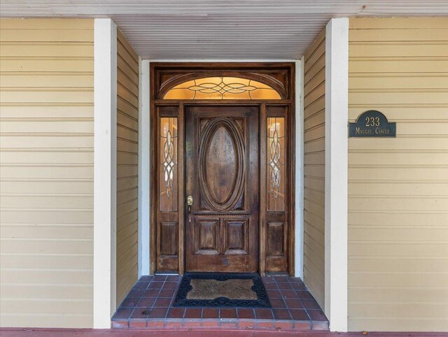 233 NE Maggie Cir, Steinhatchee, FL 32359 - doorway to property with a porch