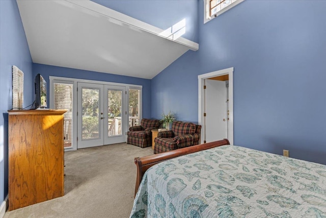 233 NE Maggie Cir, Steinhatchee, FL 32359 - bedroom with french doors, carpet floors, access to outside, multiple windows, and high vaulted ceiling