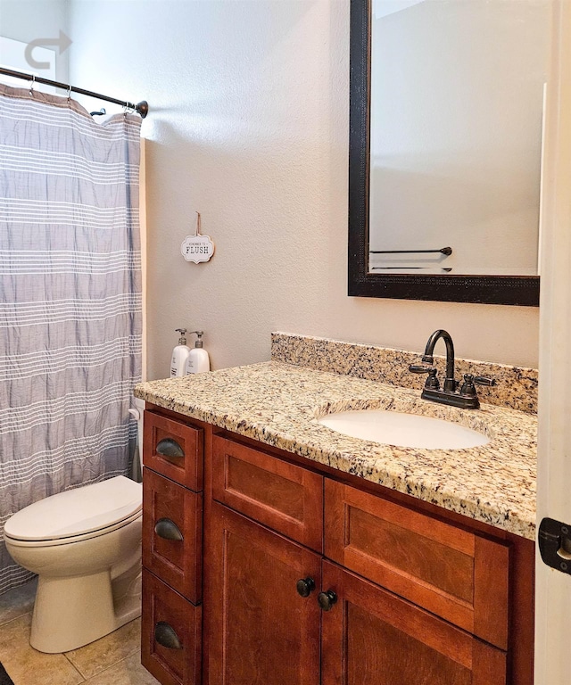 bathroom with tile patterned flooring, vanity, a shower with shower curtain, and toilet