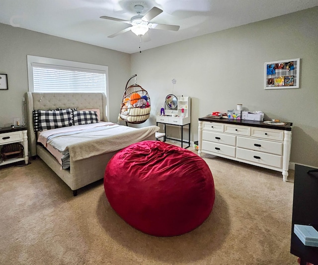 bedroom featuring ceiling fan and carpet