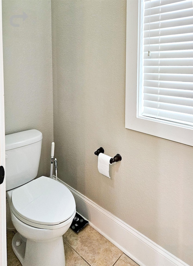 bathroom featuring tile patterned flooring and toilet