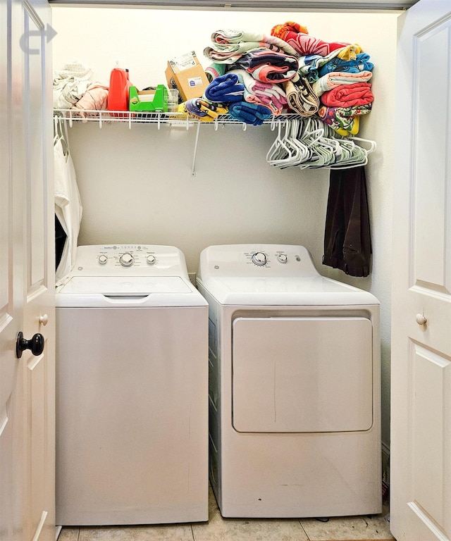 washroom featuring washer and dryer