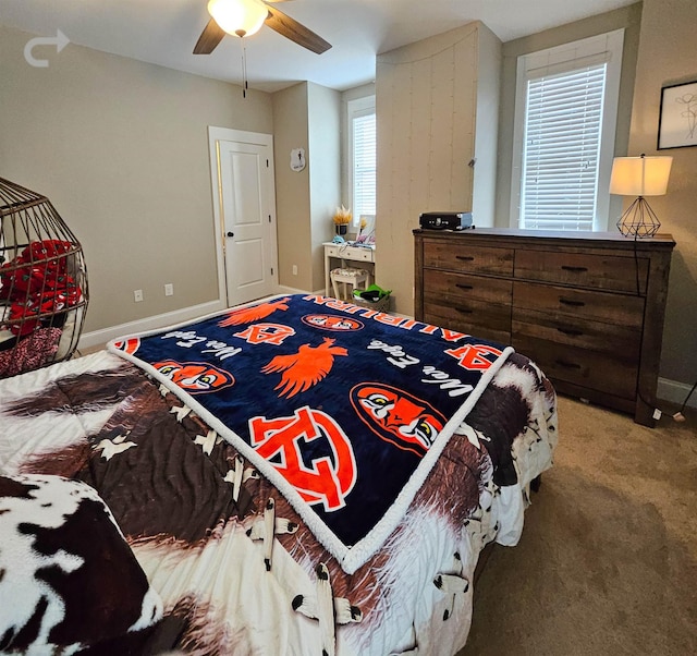 carpeted bedroom with ceiling fan