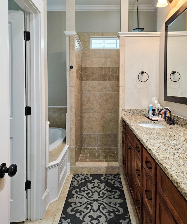 bathroom featuring crown molding, tile patterned floors, shower with separate bathtub, and vanity