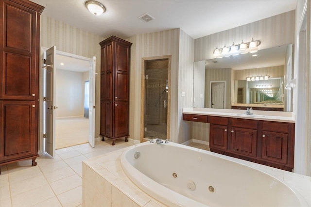 bathroom featuring tile patterned floors, separate shower and tub, and vanity