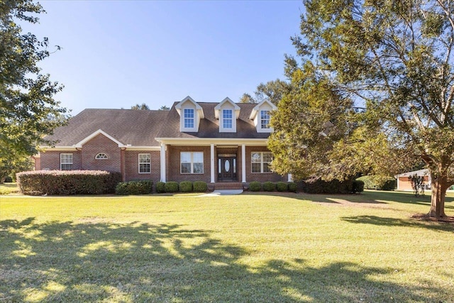 new england style home with a front lawn