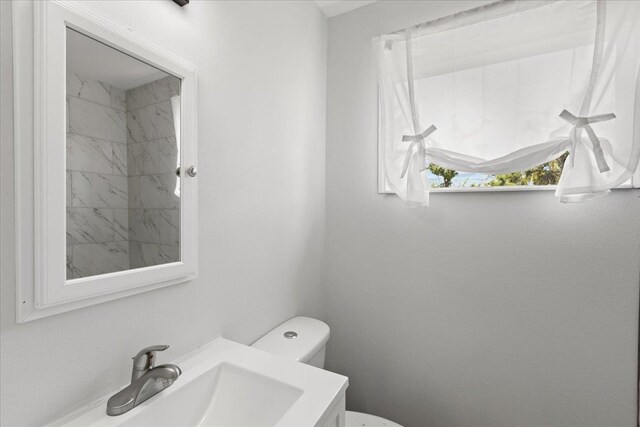 603 W Ash St, Perry, FL 32347 - bathroom featuring toilet and vanity