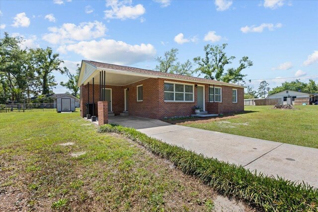 603 W Ash St, Perry, FL 32347 - ranch-style home with a carport, concrete driveway, and brick siding