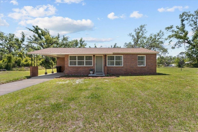 603 W Ash St, Perry, FL 32347 - ranch-style home featuring driveway, a carport, a front yard, and brick siding