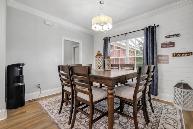 3325 Mariana Oaks Dr, Tallahassee, FL 32311 - dining space with a chandelier, crown molding, and light wood finished floors