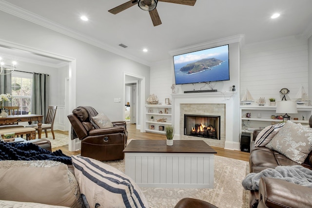 3325 Mariana Oaks Dr, Tallahassee, FL 32311 - living room featuring a ceiling fan, light wood finished floors, crown molding, a tile fireplace, and recessed lighting