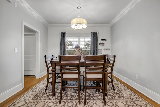 3325 Mariana Oaks Dr, Tallahassee, FL 32311 - dining area featuring a chandelier, crown molding, and wood finished floors