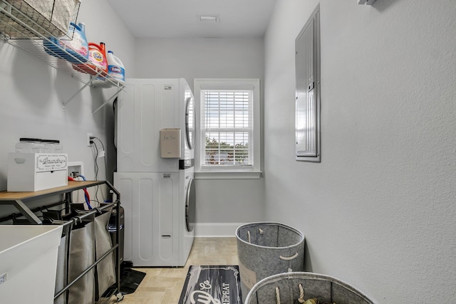 3325 Mariana Oaks Dr, Tallahassee, FL 32311 - washroom featuring stacked washer / dryer and baseboards