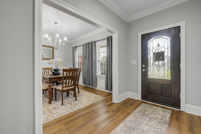 3325 Mariana Oaks Dr, Tallahassee, FL 32311 - entryway with a chandelier, crown molding, and wood finished floors