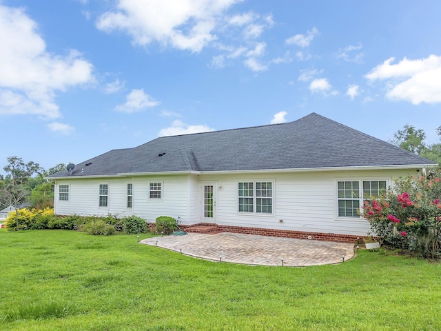 3325 Mariana Oaks Dr, Tallahassee, FL 32311 - rear view of house featuring a patio area, a yard, and roof with shingles