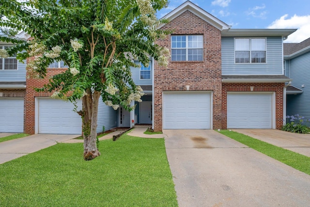 1320 Hendrix Rd Unit 403, Tallahassee, FL 32301 - view of front of home featuring brick siding, a front lawn, and driveway